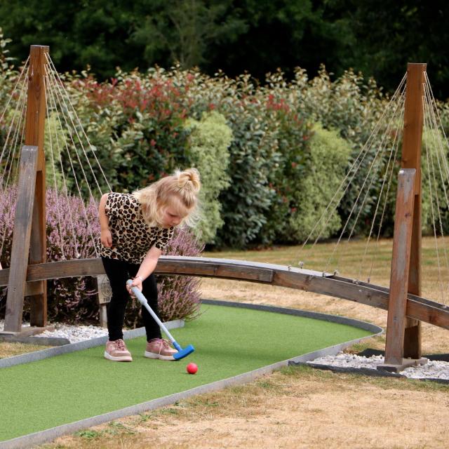 A little girl's mini-golf day at Green Mini Golf